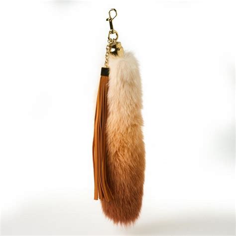 louis vuitton fox tail bag charm|louis vuitton luggage charms.